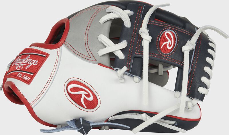 Thumb of a PRONP4-USA Heart of the Hide USA infield glove with a white thumb, navy trim and navy I-web