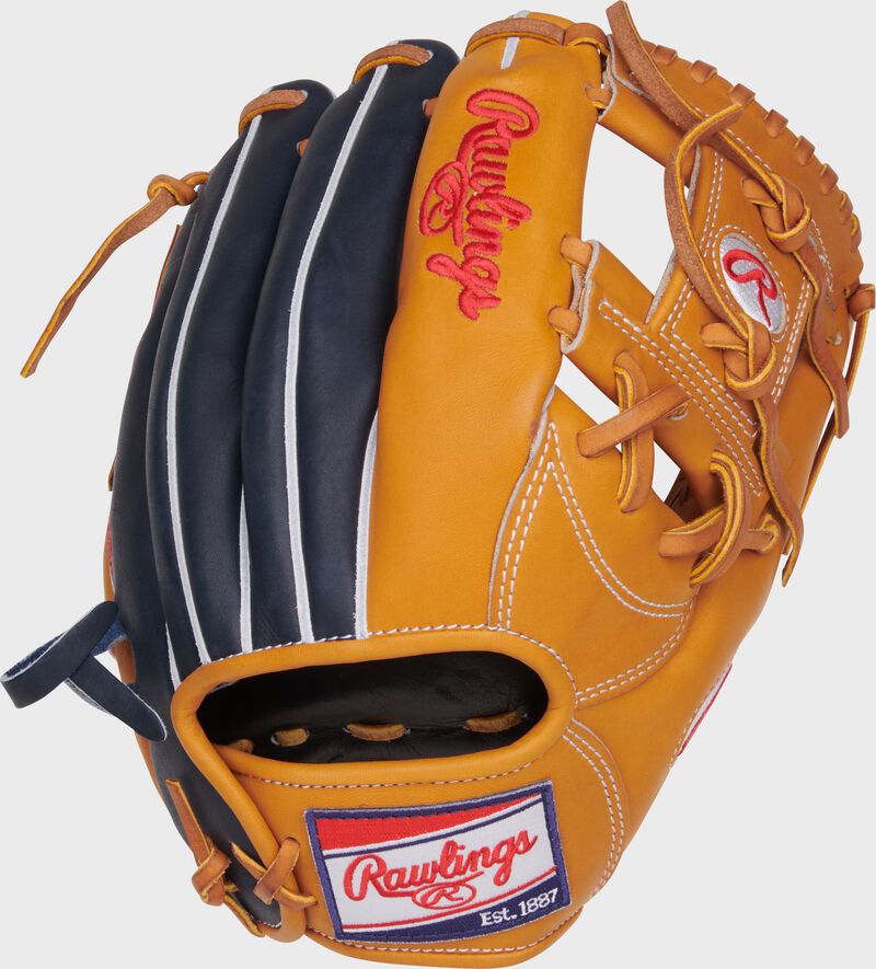 Navy/tan back of a Heart of the Hide 11.5" I-web glove with a red/white/blue Rawlings patch