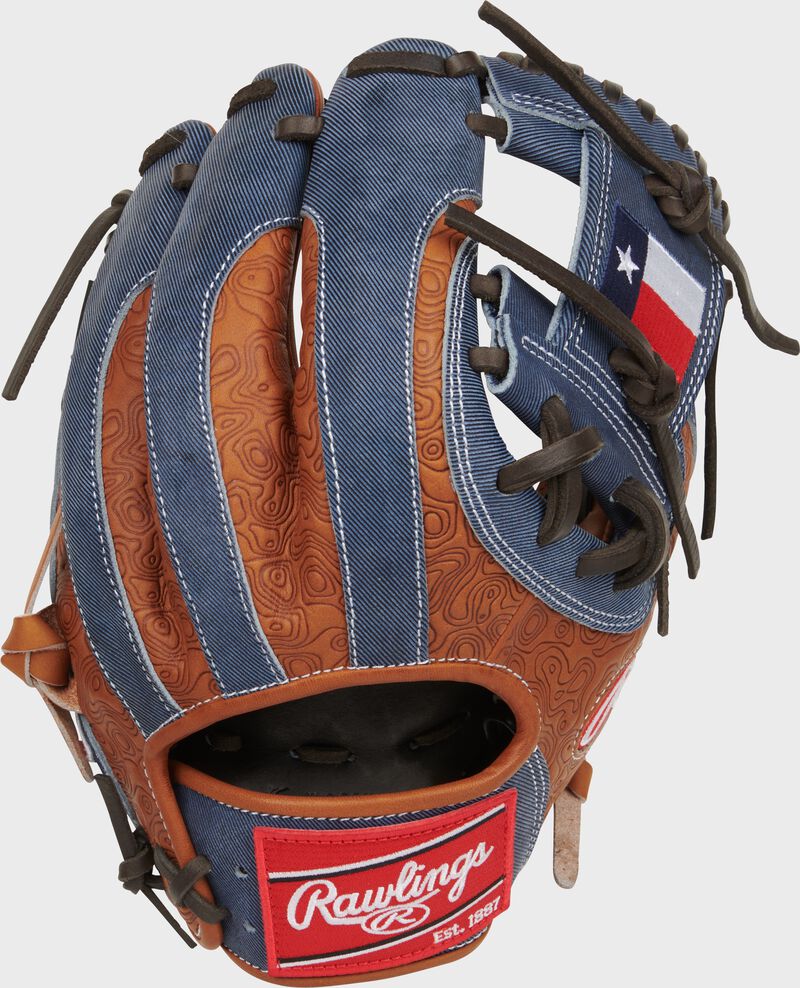 Printed tan leather and denim back of a Heart of the Hide 2024 ASG glove with a red Rawlings patch
