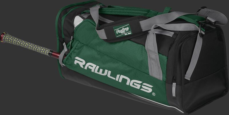 Side angle view of a dark green R601 Hybrid players duffel bag with a bat in the side sleeve