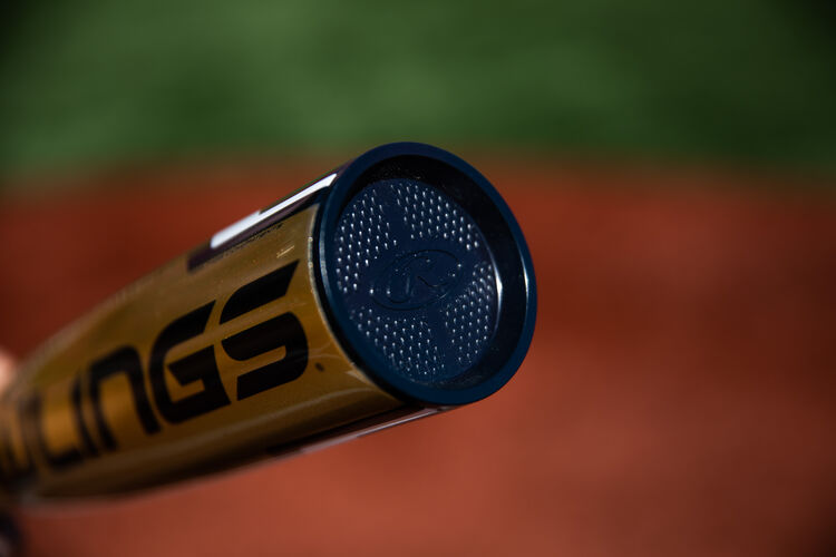 Navy end cap of a Rawlings Threat USA bat with a field in the background - SKU: USZT12