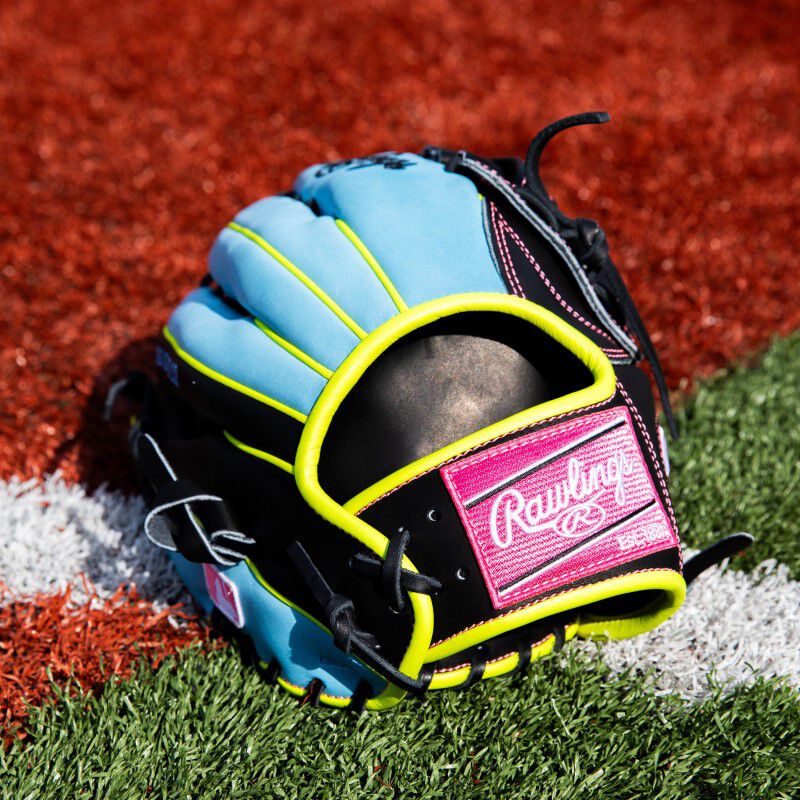 Back wrist strap of a Heart of the Hide ColorSync outfield glove on a field
