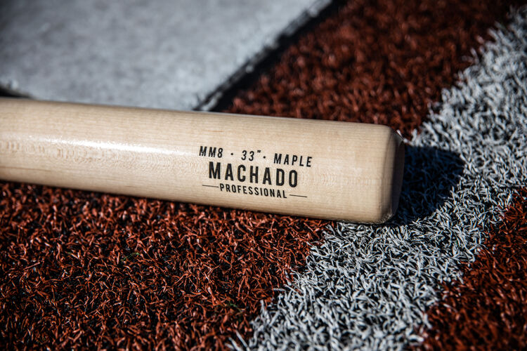 Natural barrel of a Manny Machado Pro Label bat lying on a field - SKU: MM8PL