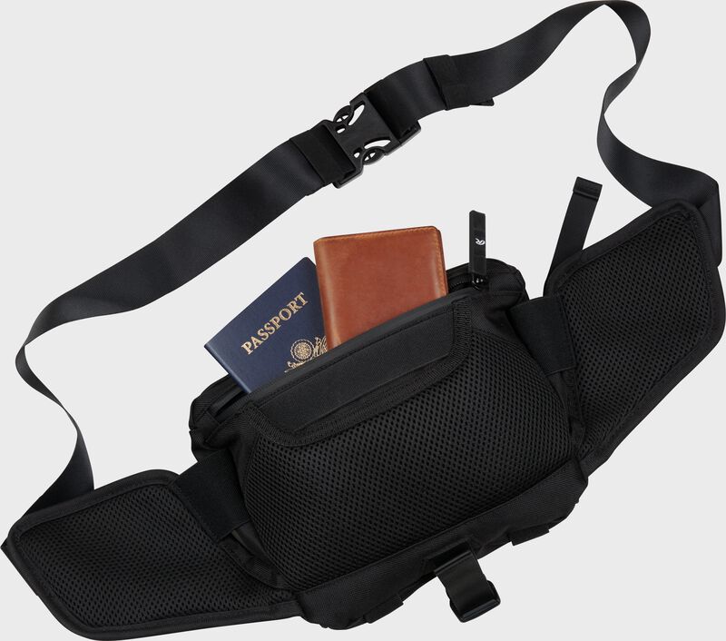 Back of a black Rawlings sling bag with a passport and wallet in the pocket - SKU: RSLING-BK
