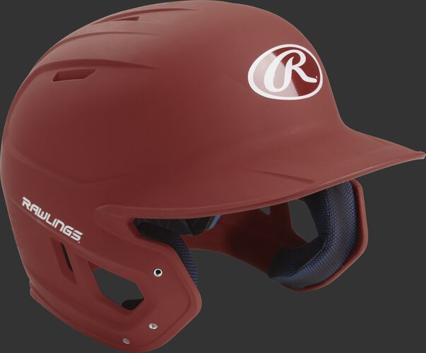 Right angle view of a matte MACH batting helmet with a cardinal shell