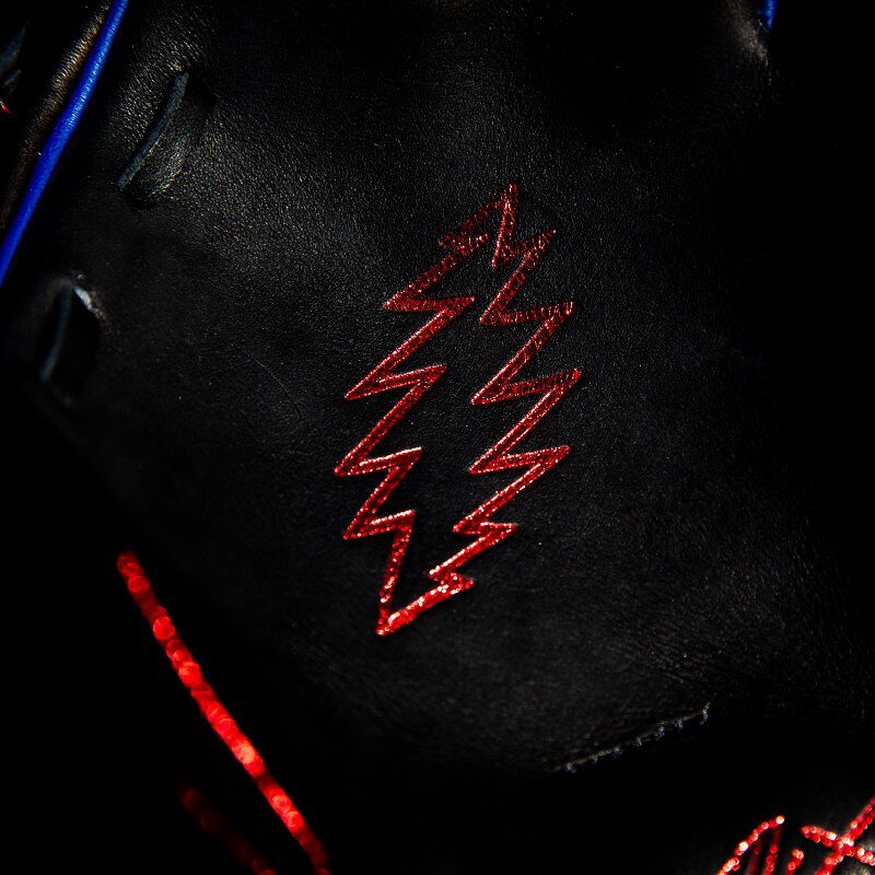 A red Lightning bolt palm stamp on a Rawlings Grateful Dead REV1X glove