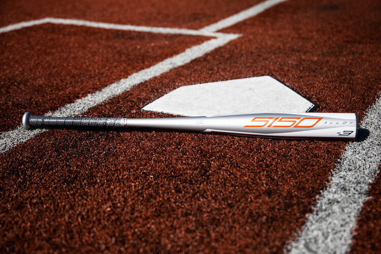 A 2020 5150 BBCOR bat lying next to home plate - SKU: BBZ53