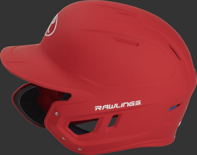 Left side of a MACHEXTL senior Rawlings batting helmet with a one-tone matte scarlet shell
