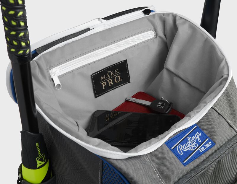 Top compartment of a royal Impulse bag with a phone, keys and black "The Mark of a Pro" patch - SKU: IMPSLE-R