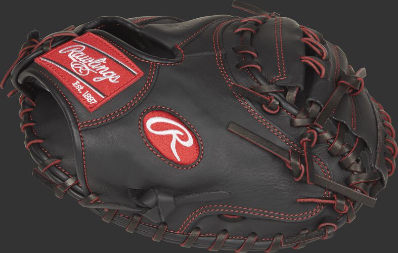 Thumb view of a black R9YPTCM32B R9 Series 32-inch youth catcher's mitt with a black one-piece solid web