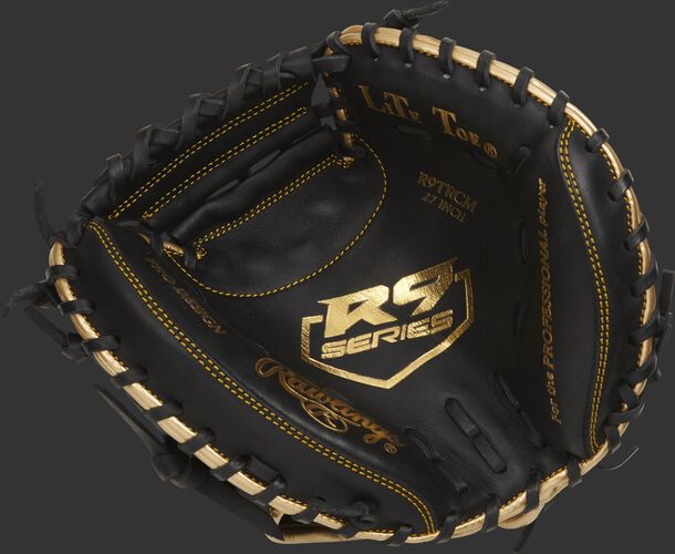 Palm of a black Rawlings R9 series catcher's training mitt with a gold palm stamp and black laces - SKU: R9TRCM