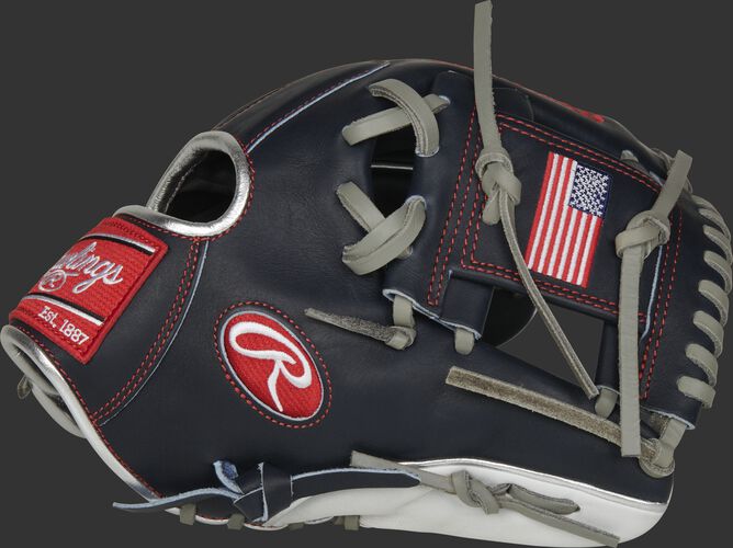 Thumb of a navy PRO204-2USA Heart of the Hide USA infield glove with a USA flag on the navy I-web