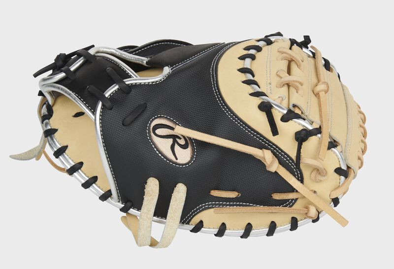 Black thumb of an exclusive Heart of the Hide 33.5-Inch catcher's mitt with a camel 1-piece solid web - SKU: PROGS24CB