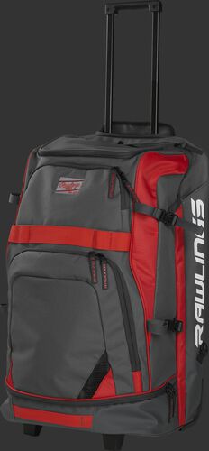 Left angle view of a grey/scarlet R1801 catcher's backpack with the pull handle extended