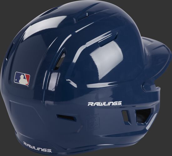 Back right of a MCH01A Rawlings Mach baseball batting helmet with a navy shell