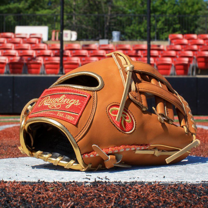 Thumb view of a Rawlings Sierra Romer Heart of the Hide glove sitting on home plate - SKU: PROSR32