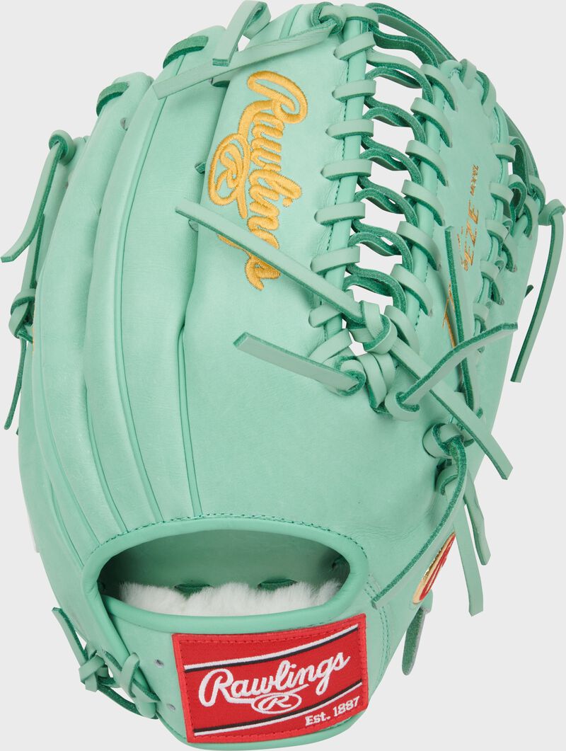 Back of an ocean mint Harrison Bader Pro Preferred outfield glove with a red Rawlings patch loading=