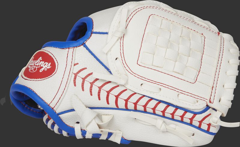 Thumb view of a white Players Series 9-inch tee ball glove with a stitching pattern across the thumb and a white Basket web