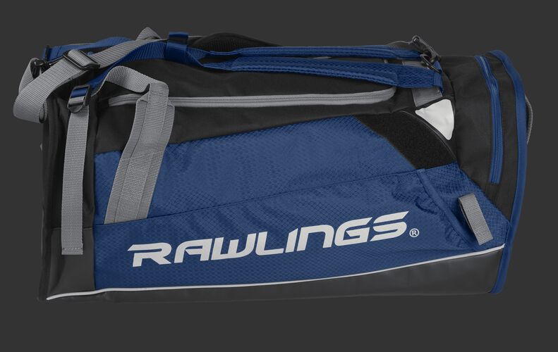 Side of a navy R601 Hybrid backpack/duffel players bag with black trim and a white Rawlings logo on the bat sleeve