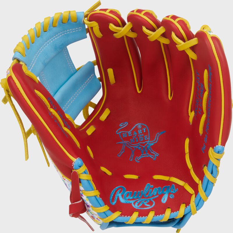Scarlet palm of a Heart of the Hide 11.5-Inch Splatter Infield Glove with Columbia blue stamping and yellow laces