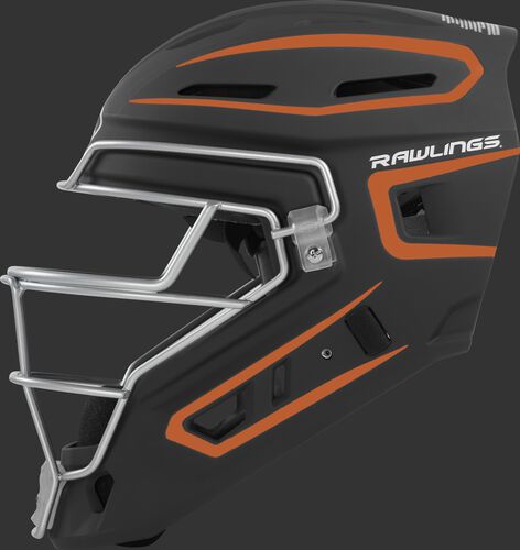 Left side of a black/orange CHV27J Rawlings hockey style Velo 2.0 catcher's helmet