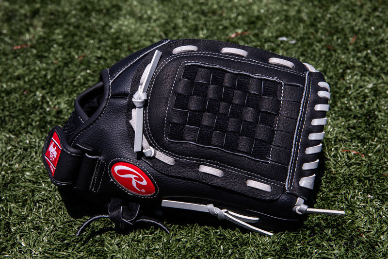 A black RSB recreational infield/pitcher's glove lying on a field - SKU: RSB120GB