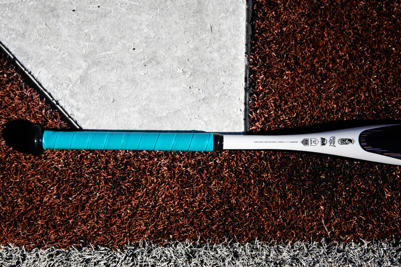 Batting grip of a Rawlings Eclipse fastpitch bat lying next to home plate - SKU: FPZE12