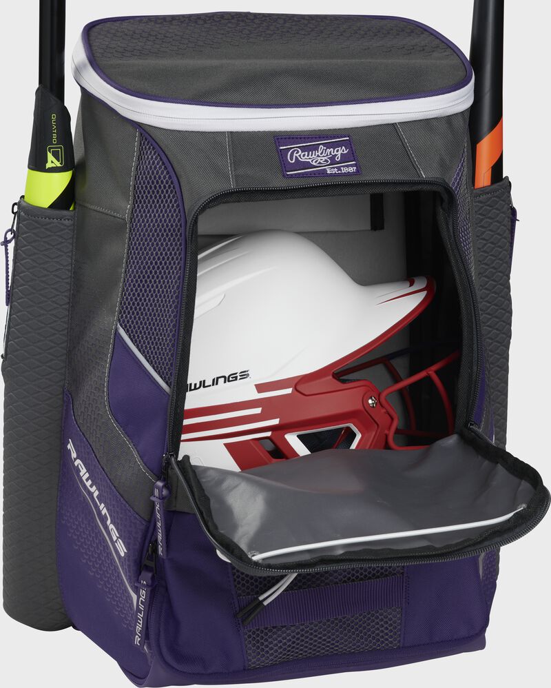 A purple Impulse baseball backpack with a helmet in the main compartment - SKU: IMPLSE-PU