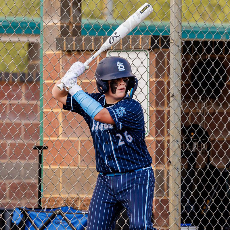 Picture of a player in his batting stance with a 2025 Icon USSSA baseball bat