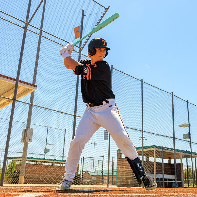 A player batting with a 2026 Rawlings Icon BBCOR bat loading=