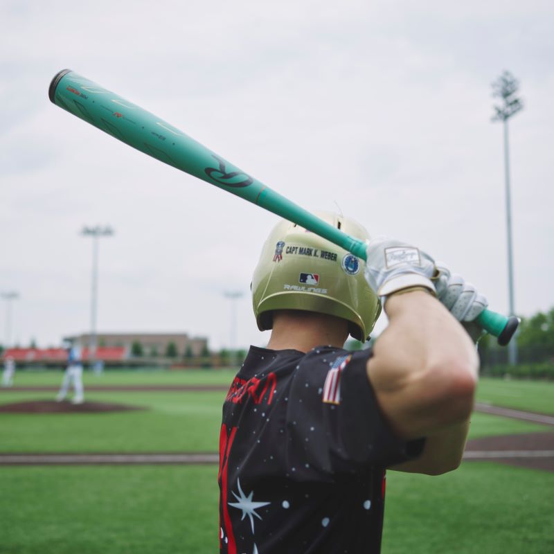 A picture from behind a player holding a Mach AI bat in his stance - SKU: RBB4MC3