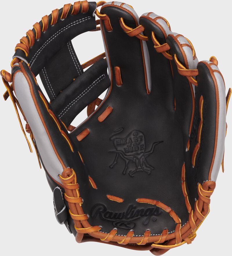 Dark Shadow palm of a Rawlings Heart of the Hide ContoUR Fit glove with tan laces