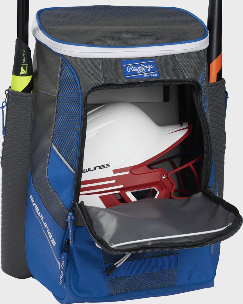 A royal Impulse baseball backpack with a helmet in the main compartment - SKU: IMPLSE-R