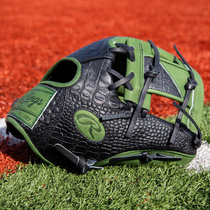 Black croc thumb of a ColorSync 8.0 Heart of the Hide infield glove on a field