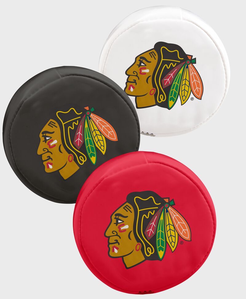 A Chicago Blackhawks three puck softee set with 1 white, 1 black and 1 red team logo puck - SKU: 00614114111
