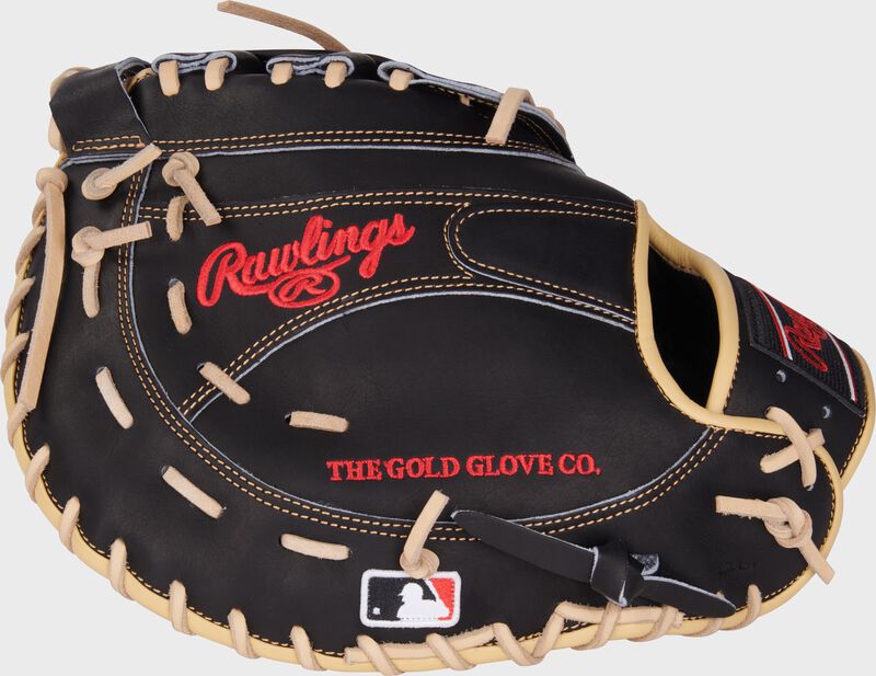 Black back of a Heart of the Hide 12.5" first base mitt with the MLB logo on the pinky