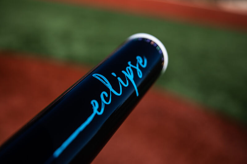 Black barrel of a 2020 Eclipse fastpitch bat with a field in the background - SKU: FPZE12