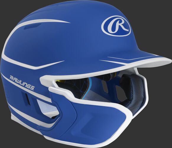Right angle view of a matte royal/white MACHEXTR Mach Senior helmet with Mach EXT left hand batter face guard extension