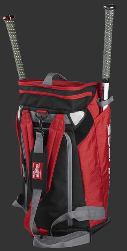 Left angle of a scarlet R601 Rawlings Hybrid players bag with two bats