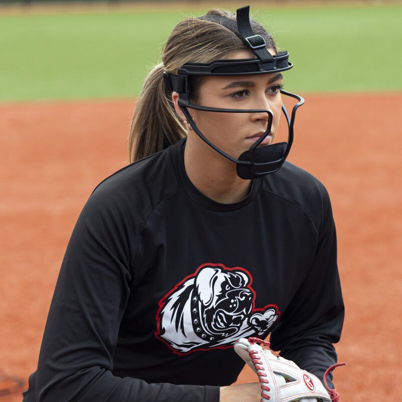 A pitcher winding up wearing a black Rawlings Hi-Viz fielder's mask - SKU: RSBFMV
