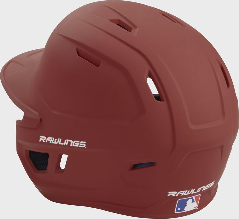 Back left view of a matte cardinal MACH series batting helmet with air vents