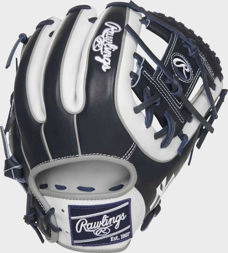 Shell back view of navy and white 2021 New York Yankees Heart of the Hide glove loading=