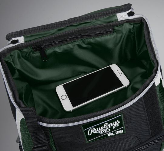 Top accessory pocket of a black/dark green R500 equipment backpack holding a phone