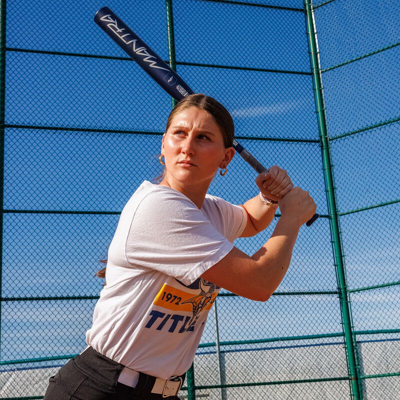 Picture of a female athlete in her stance with a 2025 Mantra fastpitch bat