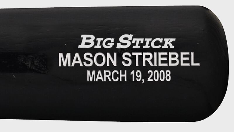 Custom text on the barrel of a black Rawlings wood bat