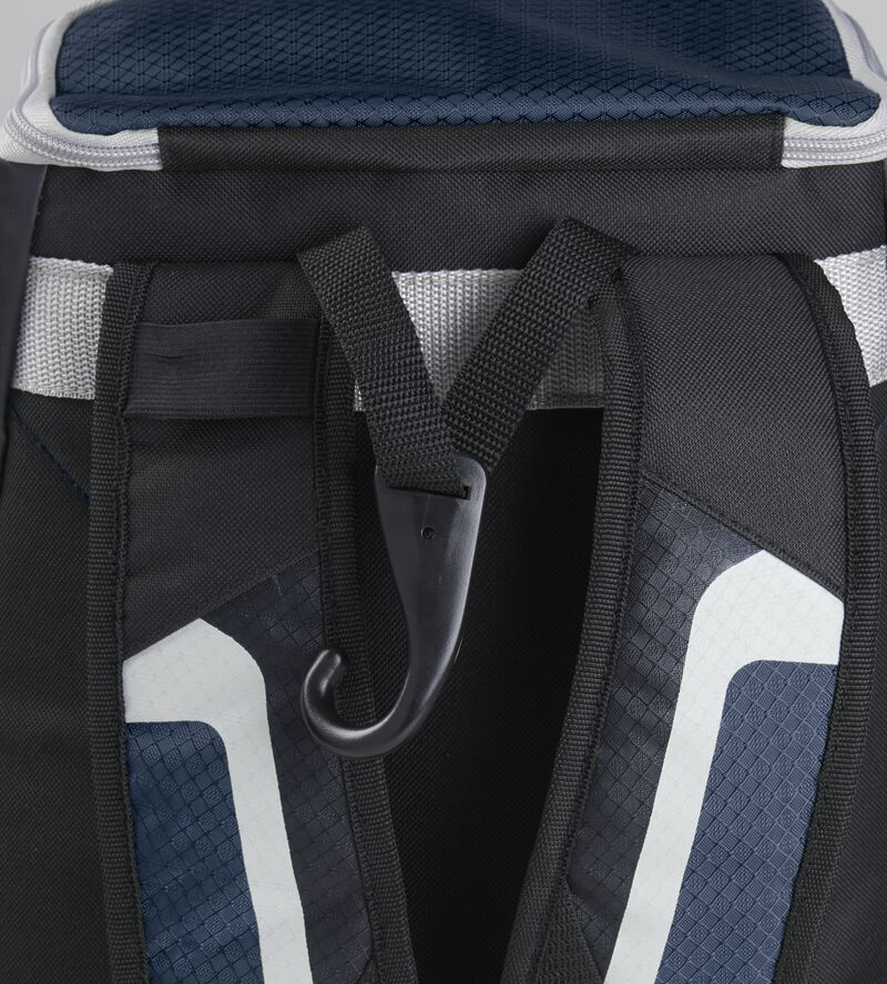 Exterior handle on the back of a black/navy R500 backpack with a hook for hanging it up