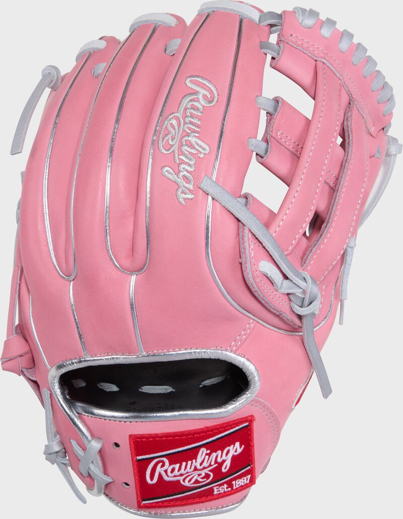 Back of a pink Gameday 57 Series Carlos Correa Heart of the Hide glove with a red Rawlings patch