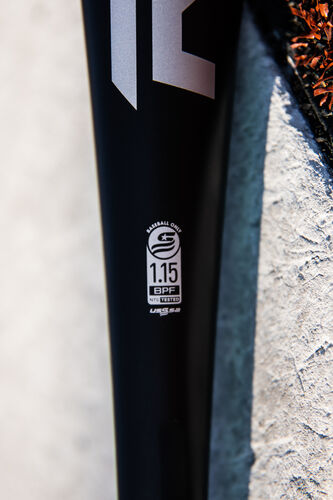 USSSA stamp on the handle of a black 5150 USSSA baseball bat laying on top of home plate - SKU: UT1510