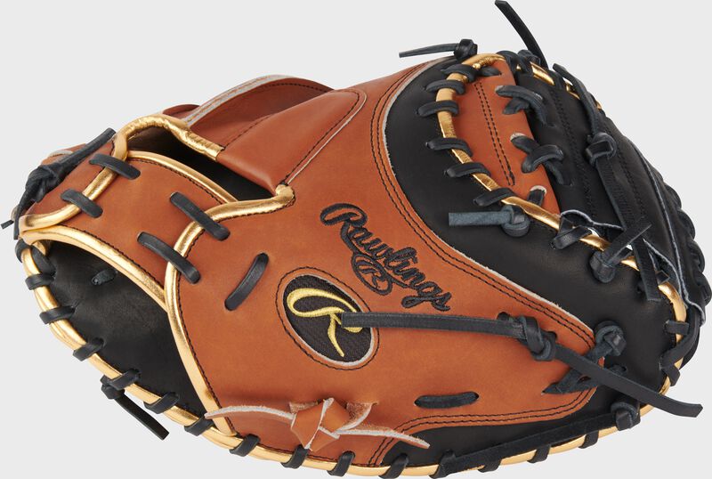 Thumb of a golden brown ColorSync 8.0 Heart of the Hide 34" catcher's mitt with a black Oval-R - SKU: PROYM4GBB