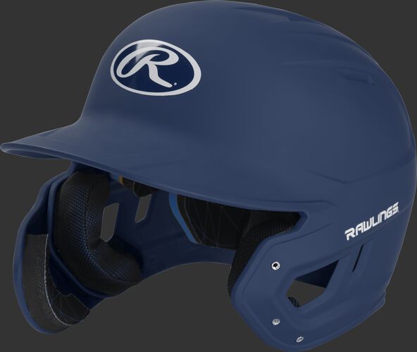 Left angle view of a MACHEXTL Rawlings Mach EXT Junior helmet with a one-tone matte navy shell